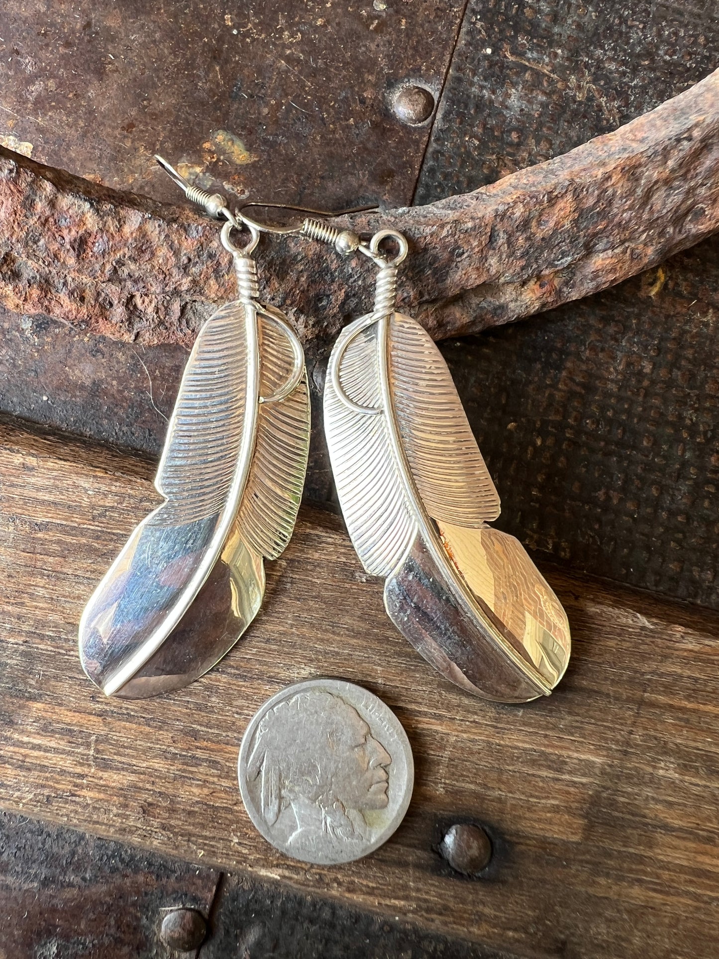 Navajo Handmade by Chester Charley Sterling silver high-shine feather dangle earrings
3” long