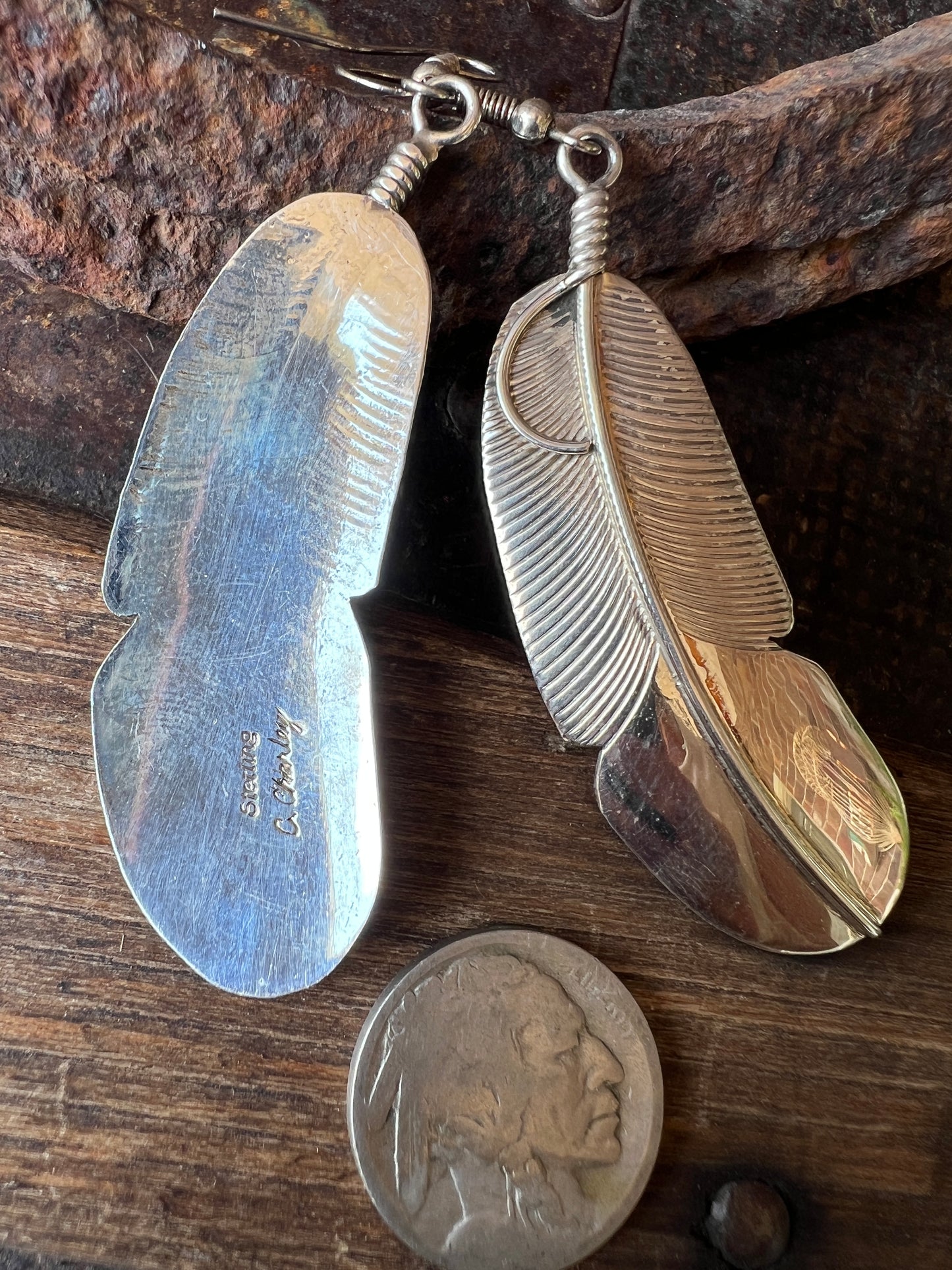 Navajo Handmade by Chester Charley Sterling silver high-shine feather dangle earrings
3” long